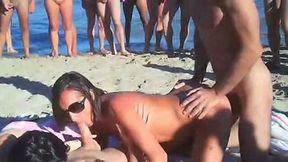Amateur swingers on the nudist beach having groupsex