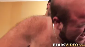 Bear couple Anthony Cox and TJ Brown trade blowjobs before bareback fucking