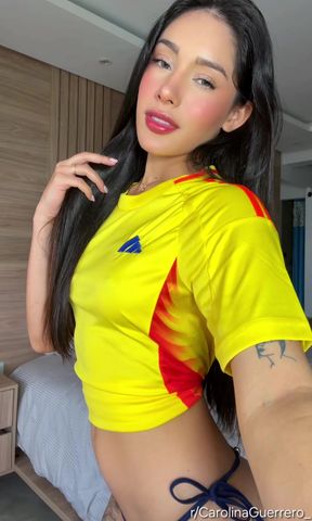 Sexy woman in yellow and red soccer jersey
