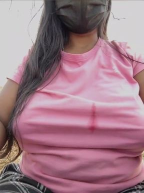 Woman wearing pink shirt and mask