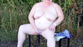 Stepmom in the Park Undressing and Masturbating on a Bench