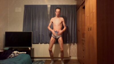 Very skinny boy shows off ribs and flexes his bones while masturbating