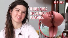 Watch as American babe Julia plays with her butt plug in the bathtub