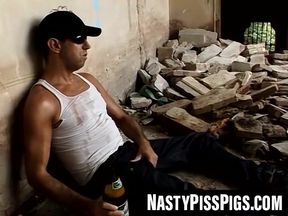 Big dick stud jacks off while pissing on himself