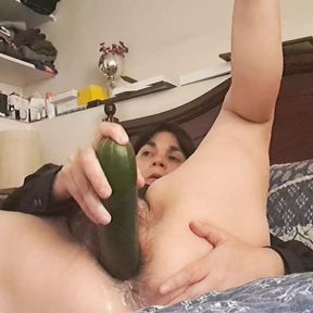 wife sticks cucumber deep in pussy