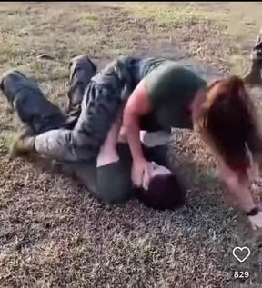 Busty wrestler takes on a rival in a sweaty showdown