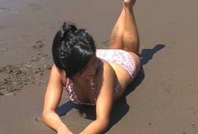 Gorgeous tight tiny brunette girl on the beach flashing