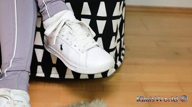White socks strain through tight lavender leggings while teasing sneakers