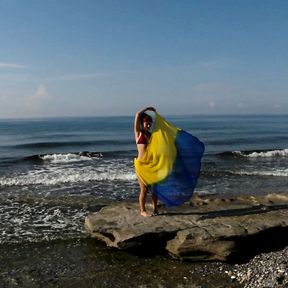 Dancing on Mediterranian Sea Beach with Yellow-Blue Shawl