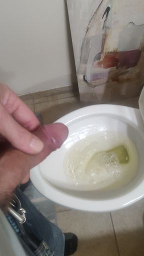 Playing with a pissing cock