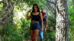 sexy brunette gets her cunt and mouth pumped hard by a bald dude in the forest