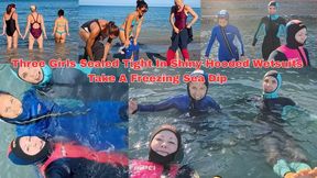 Three Girls Sealed Tight In Shiny Hooded Wetsuits Take A Freezing Sea Dip - MP4 HD