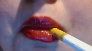 Smokes Cigarette with Whore Red Lips closeup smoke