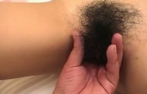 Asian whore sucks a weiner after getting her hairy cunt fingered