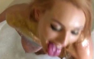 Redhead gf gives a head in bubble bath