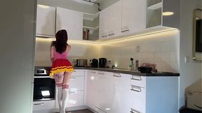 Sexy redheaded cheerleader in knee-high socks teases in kitchen