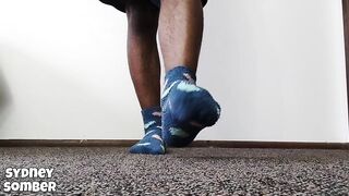 Bent soles in blue socks