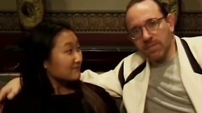 ”Sensual Asian teen has her booty banged by two guys on couch”