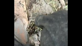 Solo Male Wading Barefoot in Lakebed of Mud