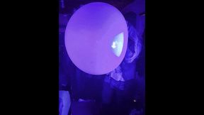 Red Wubble blowing under Blue Light