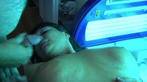 Busty Nadiene Blows Cock in Solarium