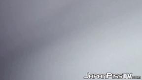 ”Delectable Japanese beauty is peeing outside during day time”