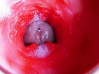 A giant jock inside a juicy aperture spews liquid and will in a short time fill with milk