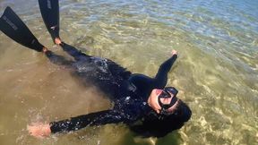 neoprene and snorkel gear in the sea