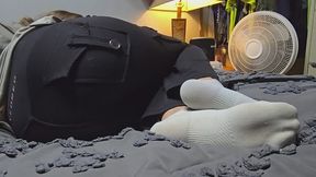 Chrissy resting socks on bed