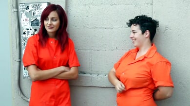 Redheaded prisoner gets spanked and pleasured by a lesbian guard in steamy prison cosplay