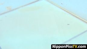 Tiny Japanese babes pissing hard in close up outdoors