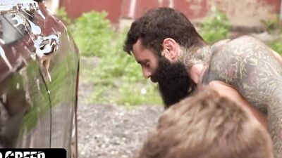 Twink is fucked in the car by a big hairy bearded bear