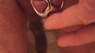 Caged cock dripping