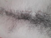 Laid back otter masturbating, shooting cum on hairy belly and chest
