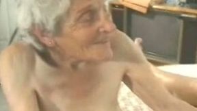 Really old white woman with no tits playing with a dick