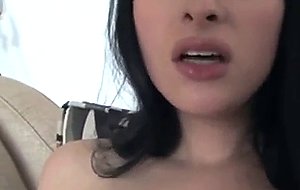 She masturbates on the sofa