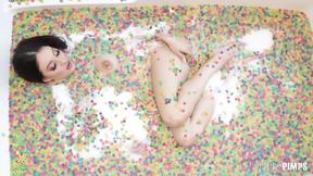 ”Big Breasted Brunette Maddy May Rubs Her Clit & Drills Herself with a Pink Dildo Solo”