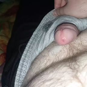 chubby guy jerks off cock through pants and cums