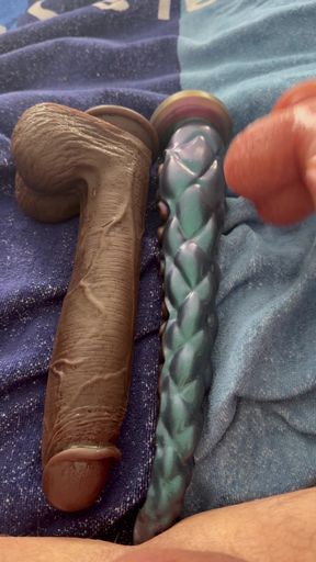 The latex titty slut pushes three monstrous dildos in a row!