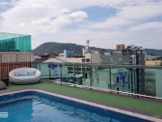 Girl with red hair sunbathes without panties by the pool