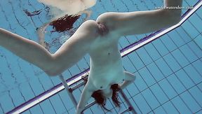 Small tittied girl Sima Lastova swimming all naked in the pool