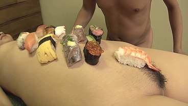 Homemade sushi served on the sexy body of a sexy Japanese girl
