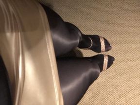 Teasing on cam wearing my black glossy tights and sexy high heels.