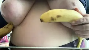 Good girl plays with bananas in her room