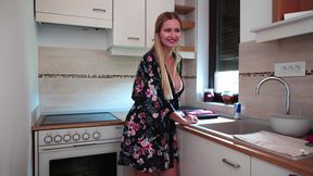 Housewife dancing in the kitchen