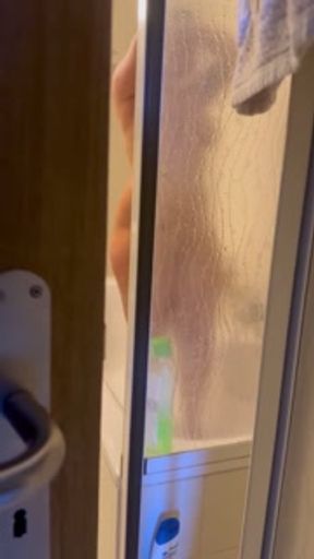 Exhibitionist wife's shower before New Year's Eve. Hot milf caught playing with her dildo.