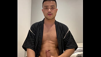 Asian boy in Jinbei stroking