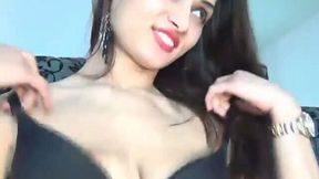 Torrid brunette Latina webcam girl squeezes dildo between her big tits