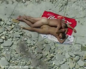 A horny young couple on the nude beach having sexy time