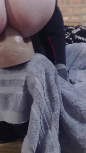 Iconic moment from "Omega Dildo from Hankey's Toys -  Mounted and Moaning on his Huge Balls"